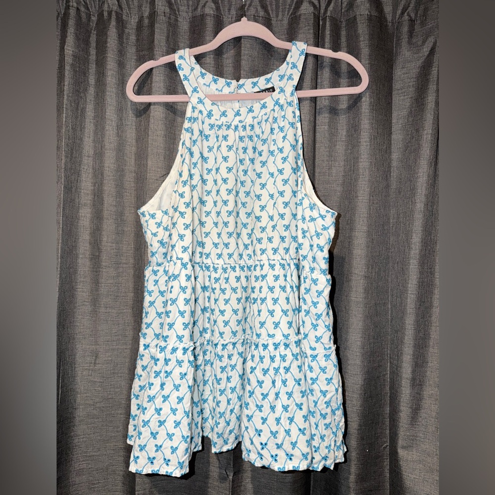 Torrid White halter with Blue eyelet design
Shift flow design size 2